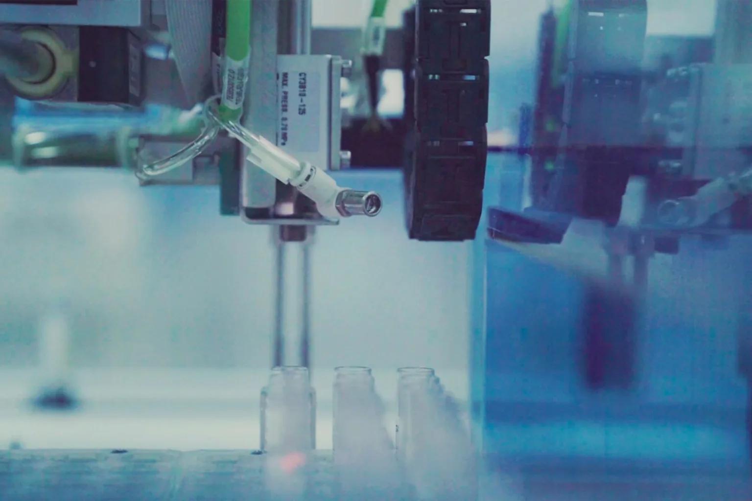 Automated laboratory instrument dispensing into sample vials