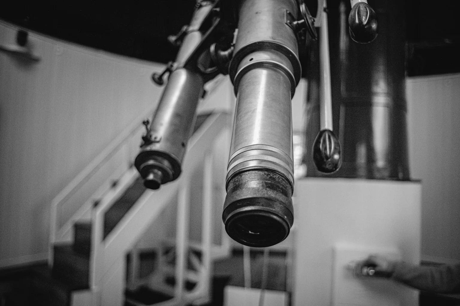 Close-up of metal-bodied optical instruments with cylindrical lenses