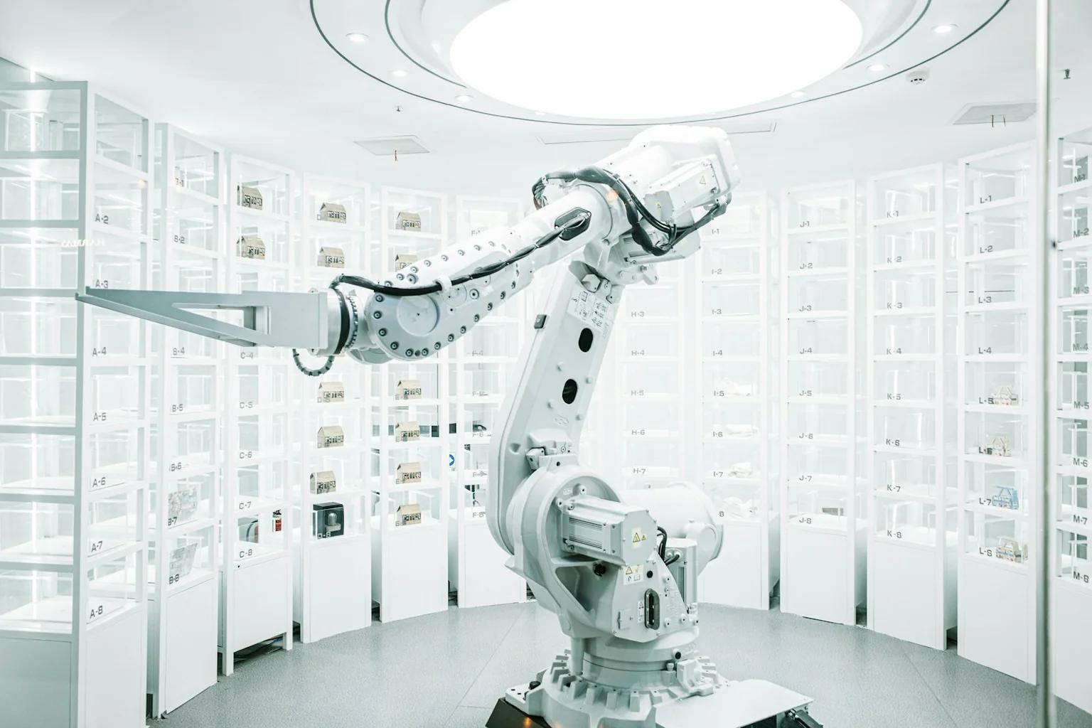 White industrial robot arm in a controlled demonstration cell